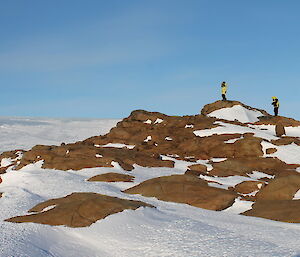 Marble Rock is a mound of rocks with two people standing on top