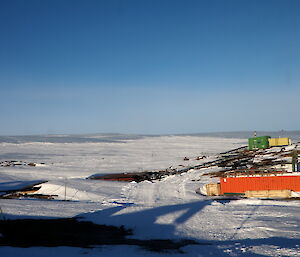 Pumphouse surrounded by snow and ice