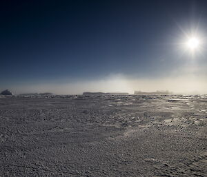 Diamond dust on the horizon over the ice.