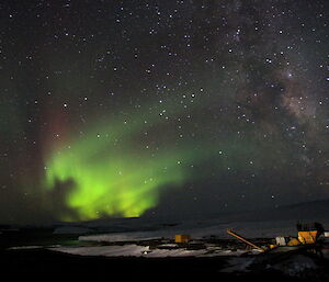 The aurora is huge a green splotch in starry night sky.