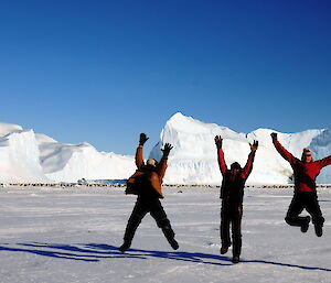 Expeditioners leaping in the air at Auster