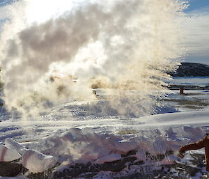 Making steam clouds by throwing water in the air.