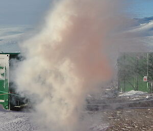 Engulfed in steam cloud so the person is hidden