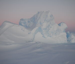 Dusk over a huge iceberg