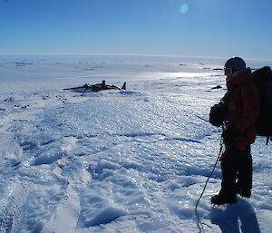 Expeditioner looking out at the icy view from Mawson plateau