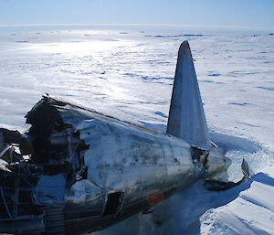 The tail and fuselage disconnected from the rest of the plane.