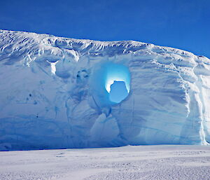 Iceberg with a glacial blue hole