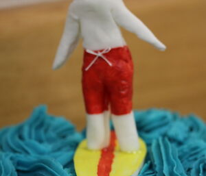 Surfer on cake