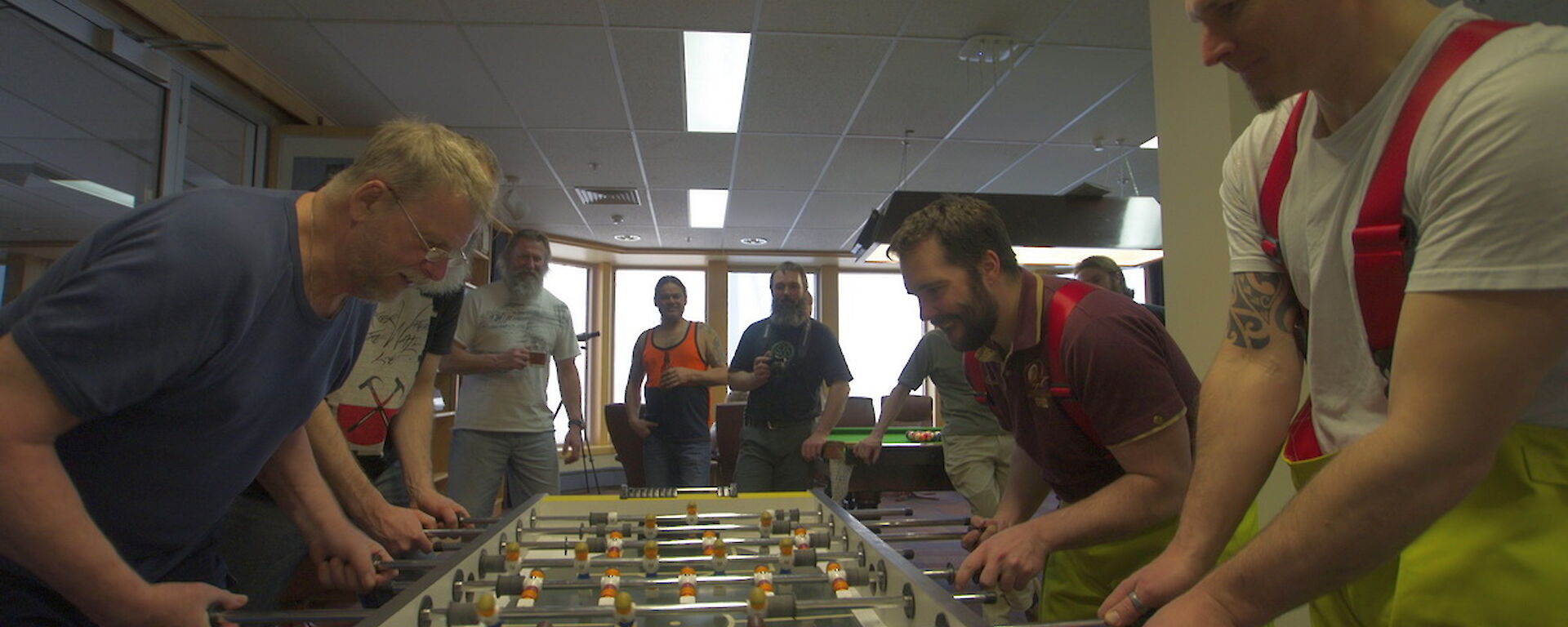 Expeditioners playing opposite each other in the tabletop football final