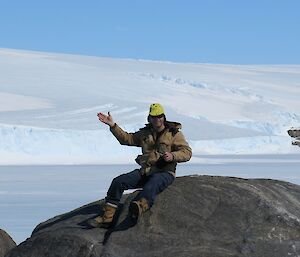 Expeditioner sitting on a rock and looking out for Skua nests