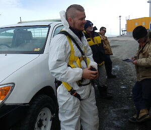 A plumber suited up for tank cleaning