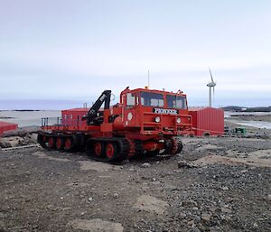 Old Pioneer bright orange oversnow vehicle