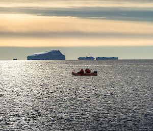 Boating at Mawson with bergs in the backgrounds.