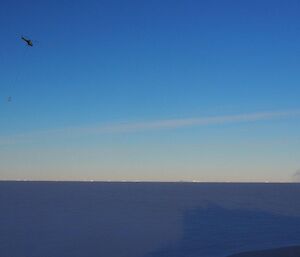 Helicopter with a sling load of cargo