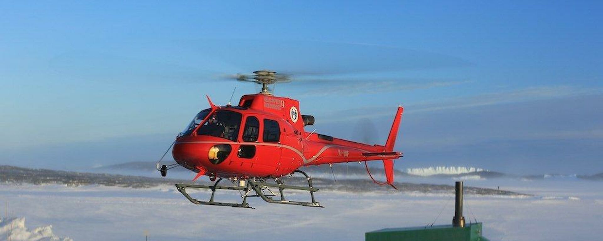 Helicopter taking off from helipad