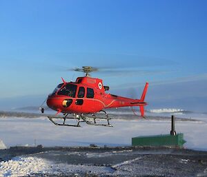 Helicopter taking off from helipad