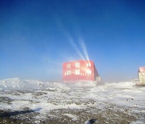 The sun reflecting off the living quarters at sunset