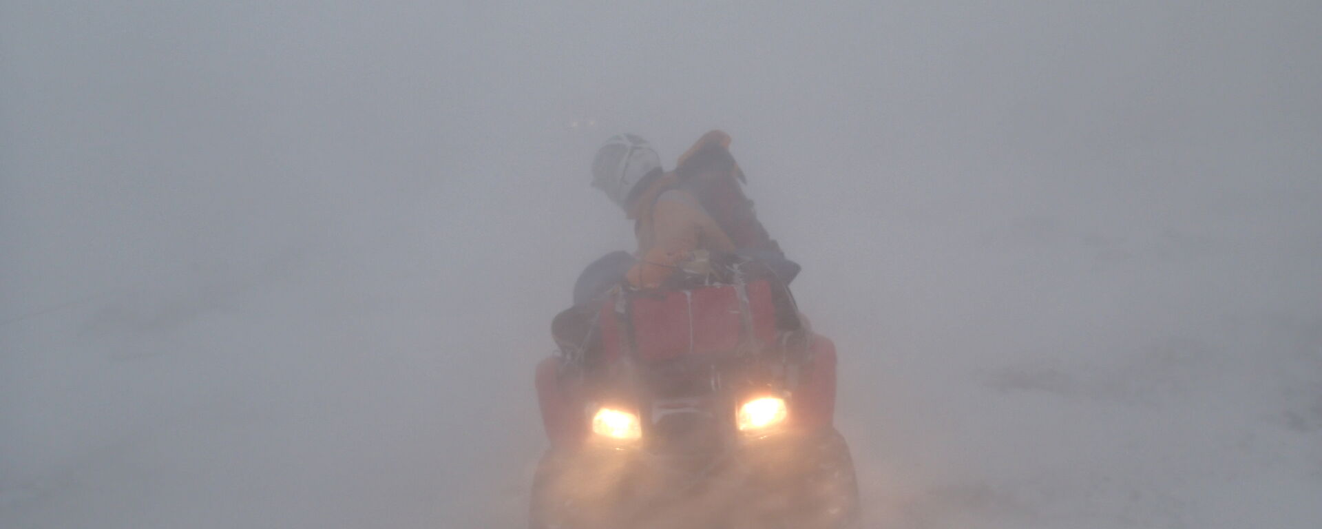 Quad Bike in snow blizzard