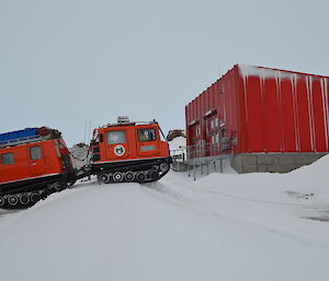 Hägglunds oversnow vehicle driving around Mawson station