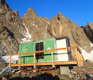 Rumdoodle hut — a small wooden hut perched on amongst large rocks