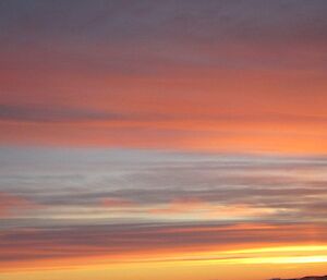 The sun setting across Horseshoe Harbour from the Mess room window