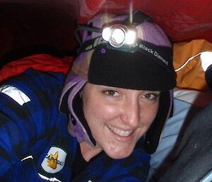 A selfie of an expeditioner inside their bivvy