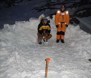 Two expeditioners checking over the sleeping pad
