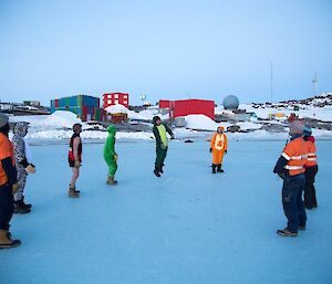 A circle of expeditioners attempting to head the ball around