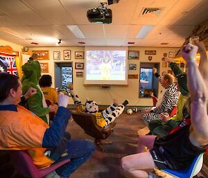 The expeditioners celebrating as the Socceroos score in the game against Chile