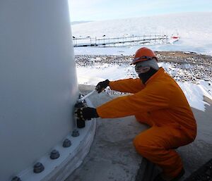 An electrician carrying out maintenance checks on the wind turbine footings