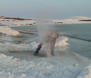 A chainsaw is used to start the swimming hole