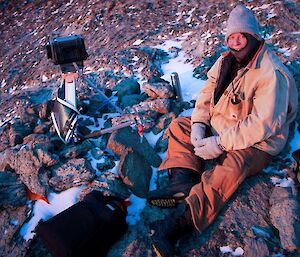 An expeditioner services one of the remote cameras