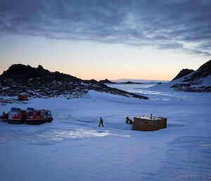 Colbeck Hut with the two Hägglunds parked nearby