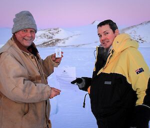 One of the expeditioners, who is also an inspector, checks another ASPA permit