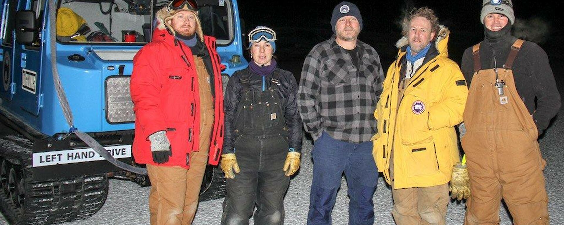 The team standing in front of the Hägglunds and about to set off for Taylor Glacier