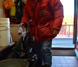 An expeditioner collecting the rubbish as part of his Saturday duties