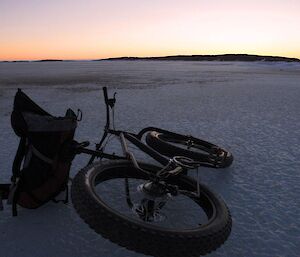 Mountain bike laying on the sea ice