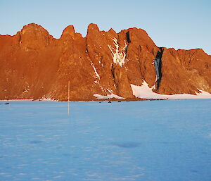 The sun beaming on to Rumdoodle Peak in the North Masson Range