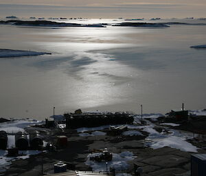 Grease ice forming on Horseshoe Harbour seen top of Mawson Station wind turbine