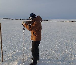 Steve drilling the sea ice