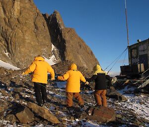 Blind folded expeditioners participating in a sweep search