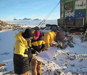 Expeditioners practising their map reading and navigation whilst in the field