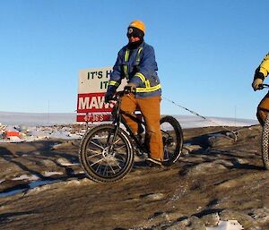 Two expeditioners riding mountain bikes on West Arm