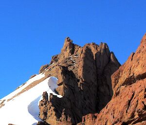 A perfect day for climbing with the sun shining down on a climber as they near the summit of Mt Hordern’s East Peak