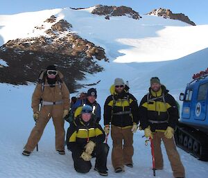 The climbing party consisting on Communication expert Garry, Carpenter Chris, Field Training Officer Heidi (kneeling), Electrician Aidan and Doctor James before setting off for the summit of Mt Hordern seen in the background