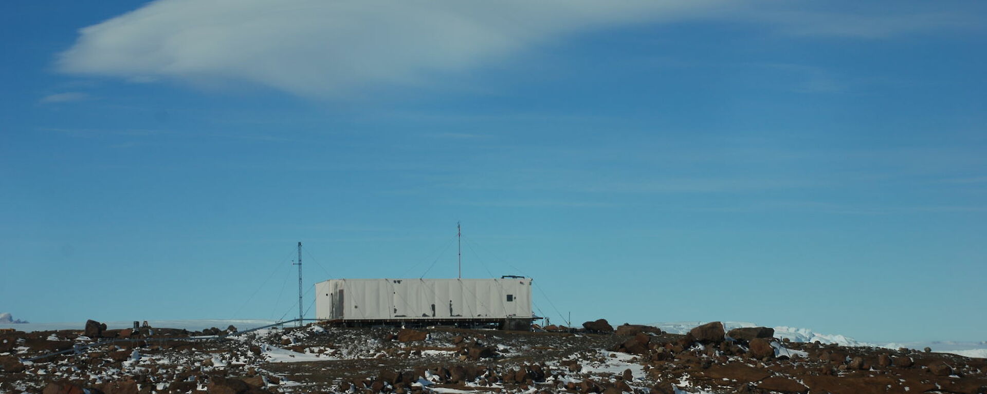 The Mawson CosRay building looking quite weather beaten as it is held down by wire heavy guage guy wires