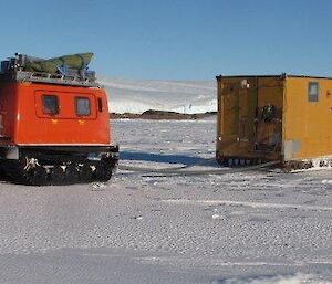 Colbeck hut being towed behind a Hägglunds on its way back to station for renovations