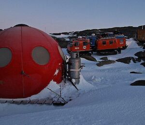 A red apple looking hut known as a googie on Macey Island