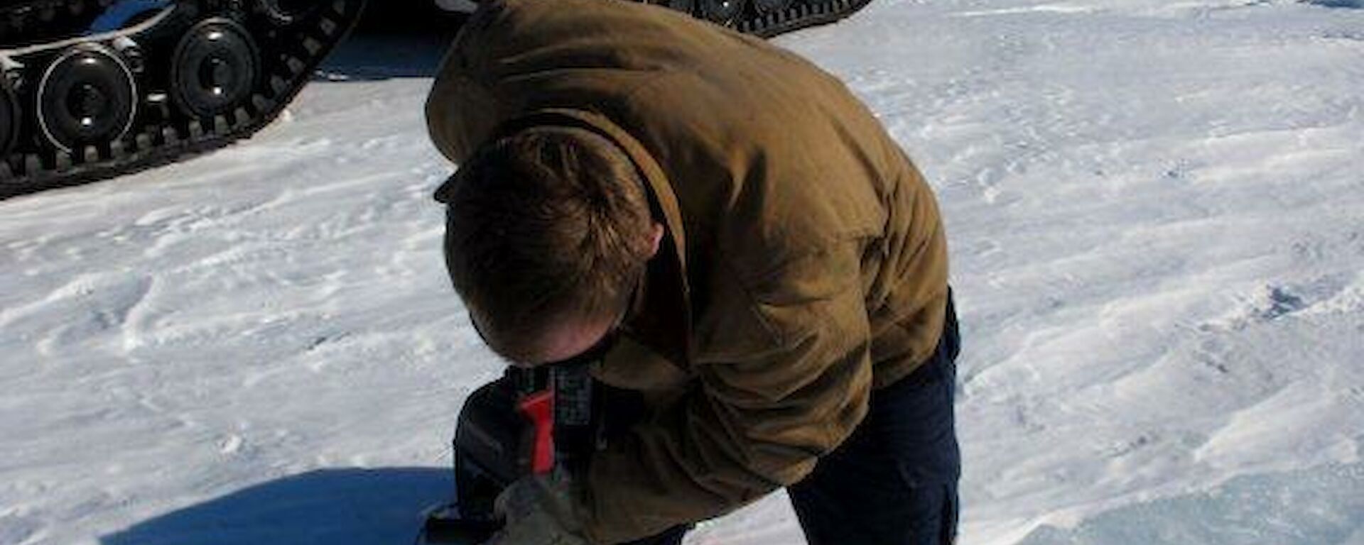 Aidan drilling the sea ice en route to Ledinghams Depot