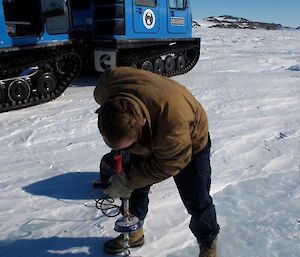 Aidan drilling the sea ice en route to Ledinghams Depot